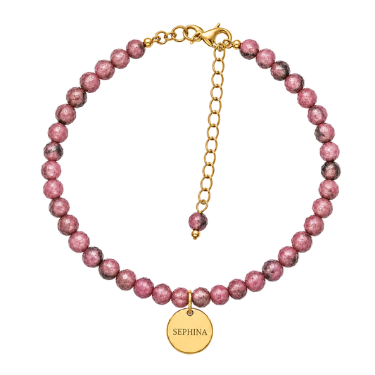 A faceted rhodonite beaded bracelet with extender chain, and a round gold signature 'SEPHINA' pendant.