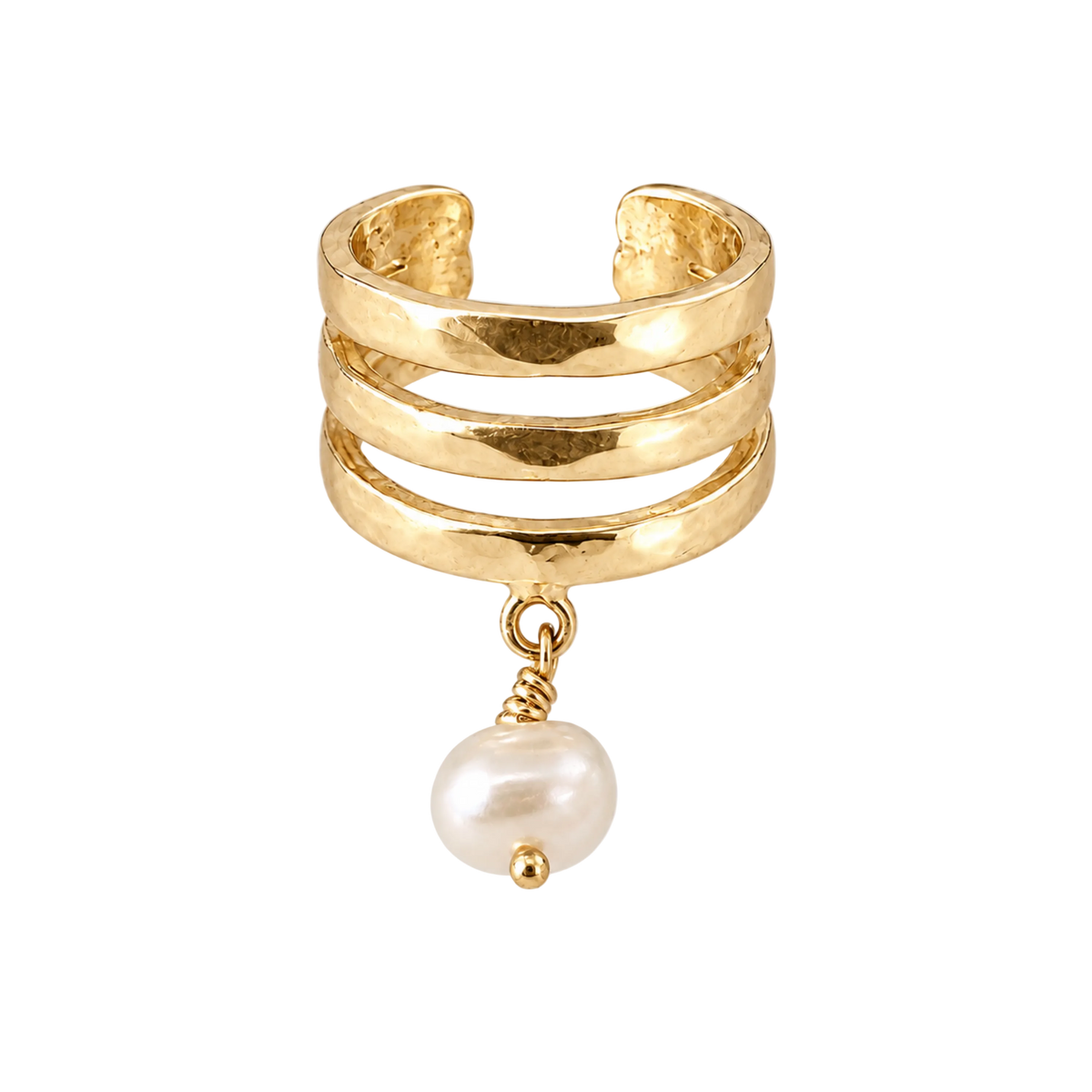 A gold-toned multi-band ring with a textured hammered finish and a dangling white freshwater pearl, shown on a light gray background.