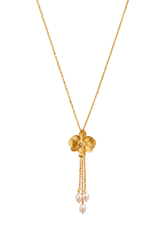 A gold Y-necklace featuring a four-petal flower pendant with a small clear crystal in the center and three dangling chains ending in white pearls, shown on a plain white background.