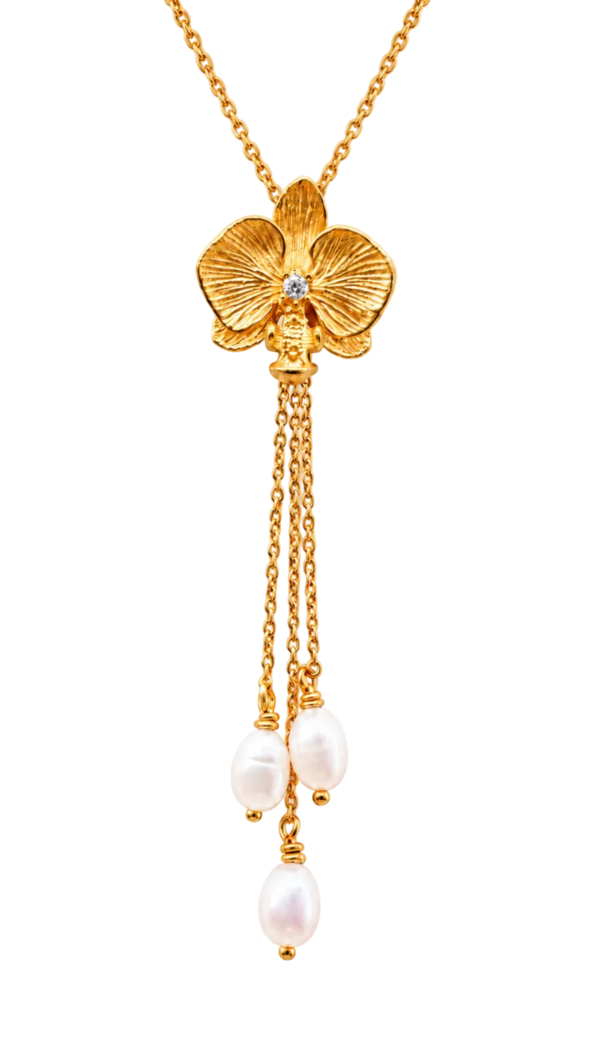 A gold orchid pendant lariat necklace with a small clear gemstone in the center of the flower, hanging from a gold chain with three dangling pearl beads on a white background.