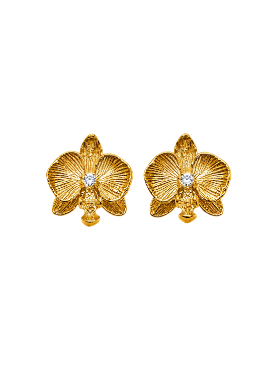 A pair of gold Sephina orchid flower stud earrings with a small clear white zirconia in the center of each flower.